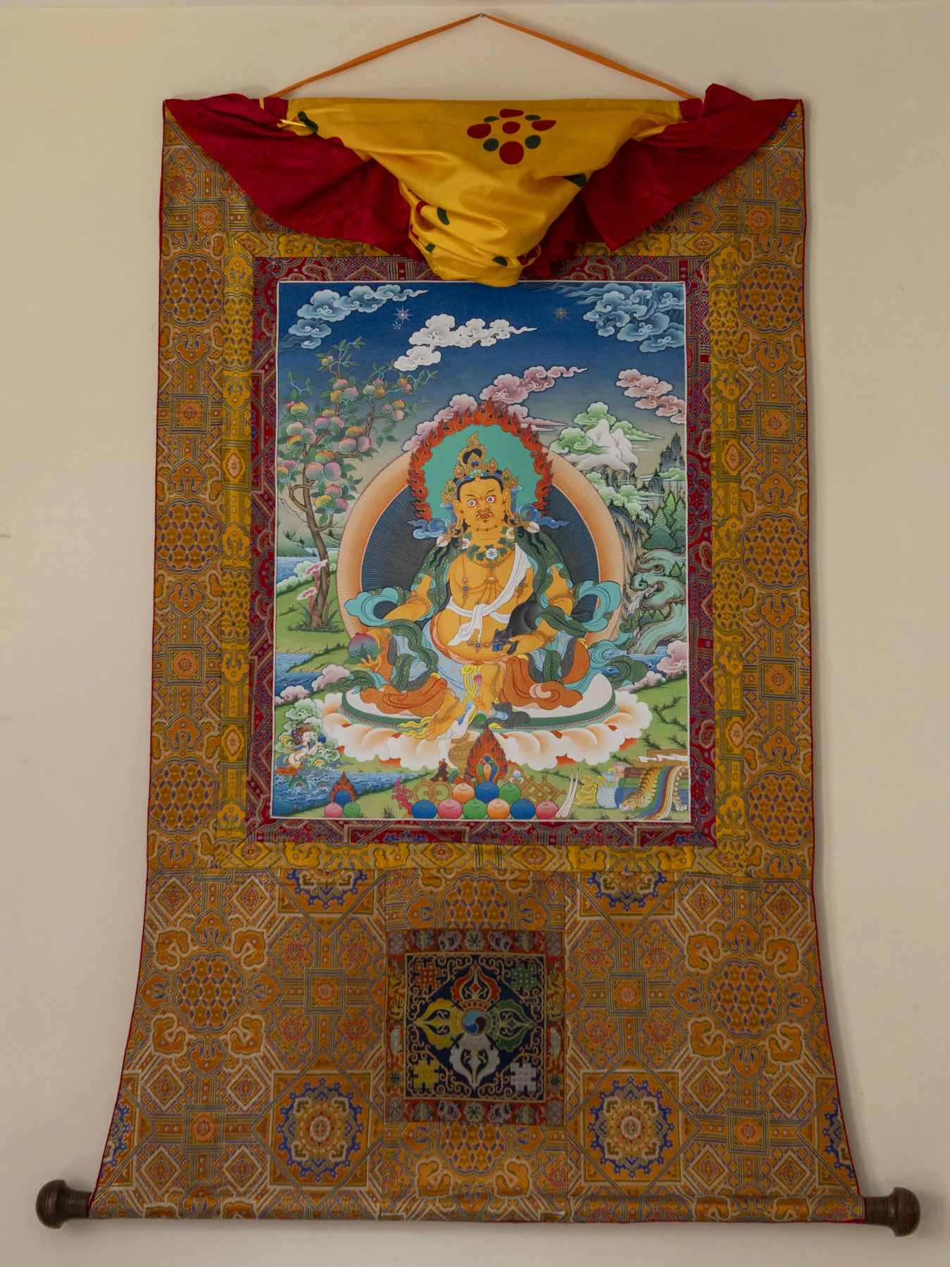 Dzambhala thangka with full brocade mount